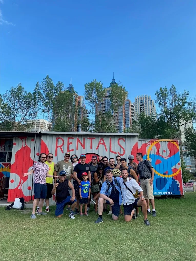 Customers gathered in front of the painted container with the Calgary skyline