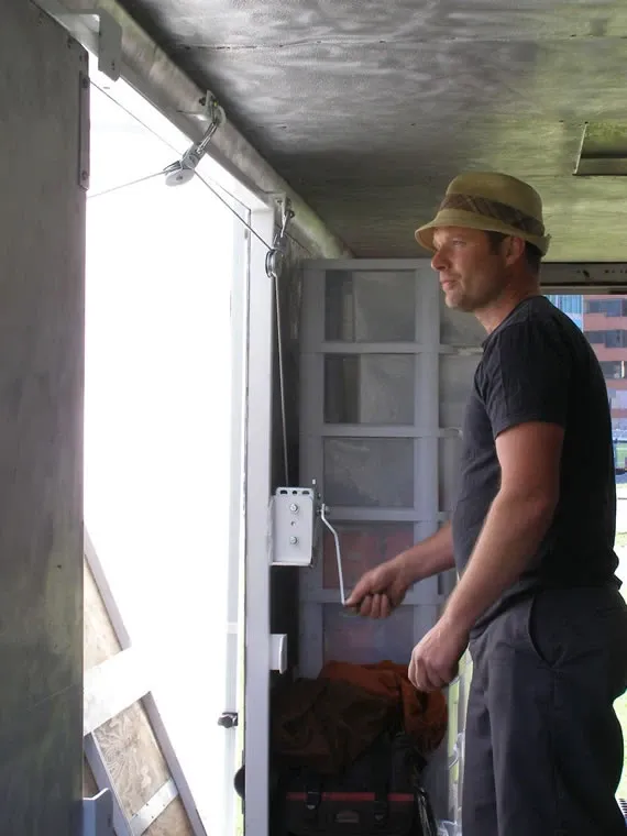 Joe lowering the fold-down deck of the GMC truck