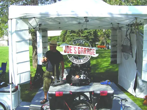 Joe's Garage Mobile Bicycle Shop, open for business under the tent with the original sign